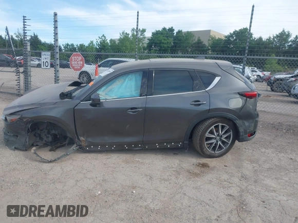 2018 Mazda CX-5 Grand Touring z VIN JM3KFADM5J1365772, wystawiony jako IAAI lot #42251805 z przebiegiem 44 599 mil mil oraz . Historia ofert i sprzedaży dostępna na DreamBid. Obrazek 13.