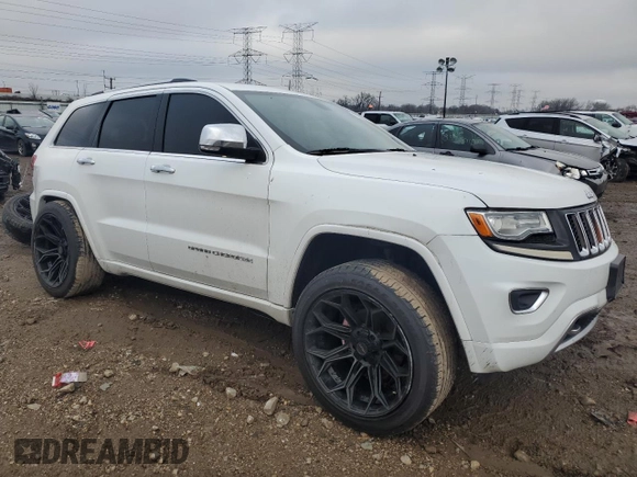 2014 Jeep Grand Cherokee Overland with VIN 1C4RJFCG7EC572298, listed as a Copart auction lot 83970004 with 104,861 mi miles and Salvage Title. Bid and sale history available at DreamBid. Image 4.