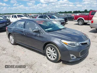 2014 Toyota Avalon Limited with VIN 4T1BK1EB3EU100754, listed as a IAAI auction lot 39446319 with 82,624 mi miles. Bid and sale history available at carsss.com. Image 1.
