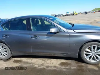 2014 Infiniti Q50 with VIN JN1BV7AP0EM682444, listed as a IAAI auction lot 41857312 with 140,765 mi miles. Bid and sale history available at carsss.com. Image 13.