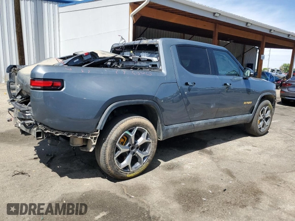2023 Rivian R1T Adventure z VIN 7FCTGAAA4PN021950, wystawiony jako Copart lot #57800485 z przebiegiem 2 480 mil mil oraz Szkoda całkowita • Salvage title. Historia ofert i sprzedaży dostępna na DreamBid. Obrazek 3.