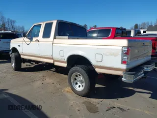 1996 Ford F-150 with VIN 1FTEX14N4TKA28292, listed as a IAAI auction lot 41422154 with 173,728 mi miles. Bid and sale history available at carsss.com. Image 3.