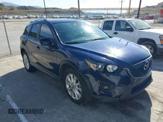 2014 Mazda CX-5 Grand Touring with VIN JM3KE2DY7E0376389, listed as a IAAI auction lot 42014946 with 126,081 mi miles. Bid and sale history available at carsss.com. Image 1.