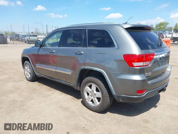 2011 Jeep Grand Cherokee Laredo with VIN 1J4RR4GGXBC587911, listed as a IAAI auction lot 42156885 with 178,999 mi miles and . Bid and sale history available at DreamBid. Image 3.