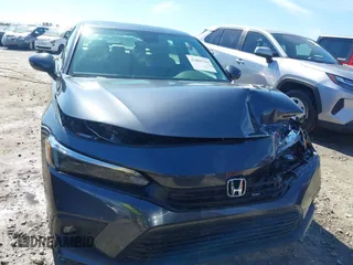 2023 Honda Civic Sedan Touring with VIN 2HGFE1F92PH318894, listed as a IAAI auction lot 41665714 with 15,746 mi miles. Bid and sale history available at carsss.com. Image 12.
