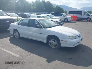 1997 Pontiac Grand Am with VIN 1G2NW52T3VC741973, listed as a IAAI auction lot 42773618 with 216,590 mi miles and . Bid and sale history available at DreamBid. Image 1.
