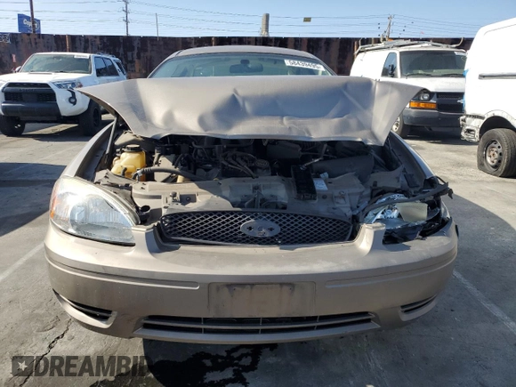 2005 Ford Taurus SE z VIN 1FAFP53215A212736, wystawiony jako Copart lot #58439495 z przebiegiem Nie podano mil oraz Szkoda całkowita • Salvage title. Historia ofert i sprzedaży dostępna na DreamBid. Obrazek 5.