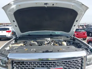 2016 GMC Sierra 2500HD Denali z VIN 1GT12UE89GF172877, wystawiony jako IAAI lot #41807741 z przebiegiem 36 719 mil mil oraz . Historia ofert i sprzedaży dostępna na DreamBid. Obrazek 10.