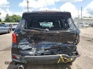 2023 Honda Passport Elite with VIN 5FNYF8H01PB030270, listed as a Copart auction lot 61402965 with 7,931 mi miles and Salvage title. Bid and sale history available at DreamBid. Image 6.