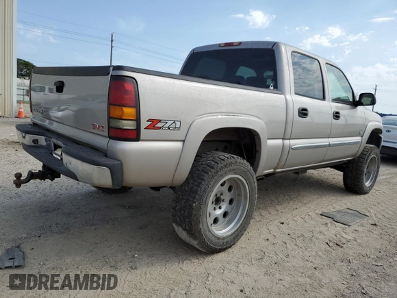 2004 GMC Sierra 1500 SLT z VIN 2GTEK13T241405721, wystawiony jako Copart lot #54399704 z przebiegiem 165 512 mil mil oraz Czysty tytuł • Clean title. Historia ofert i sprzedaży dostępna na DreamBid. Obrazek 3.