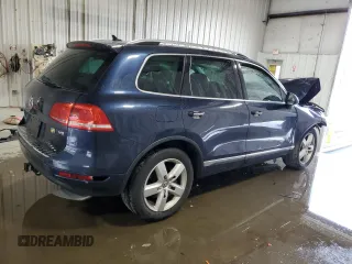 2014 Volkswagen Touareg Sport с VIN WVGEF9BP2ED002718, выставлен на аукционе Copart как лот 59526575 с пробегом 194 480 миль миль и На запчасти • Non repairable. История ставок и продаж доступна на DreamBid. Изображение 3.