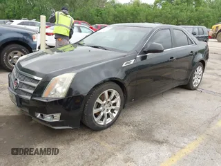 2009 Cadillac CTS AWD w/1SB with VIN 1G6DT57V290165006, listed as a IAAI auction lot 42144947 with 162,969 mi miles. Bid and sale history available at carsss.com. Image 2.
