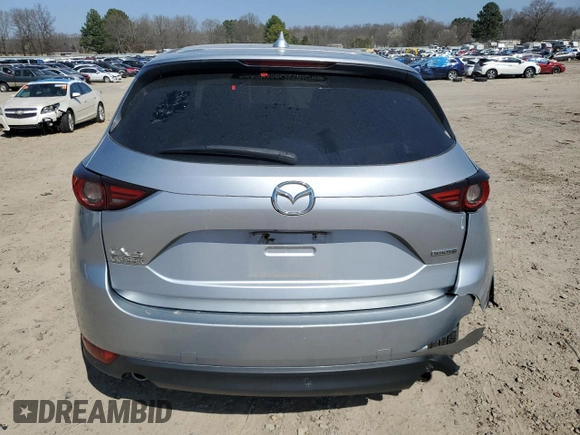 2021 Mazda CX-5 Grand Touring with VIN JM3KFADM6M0387094, listed as a Copart auction lot 48350845 with 94,701 mi miles and Salvage Title. Bid and sale history available at carsss.com. Image 6.