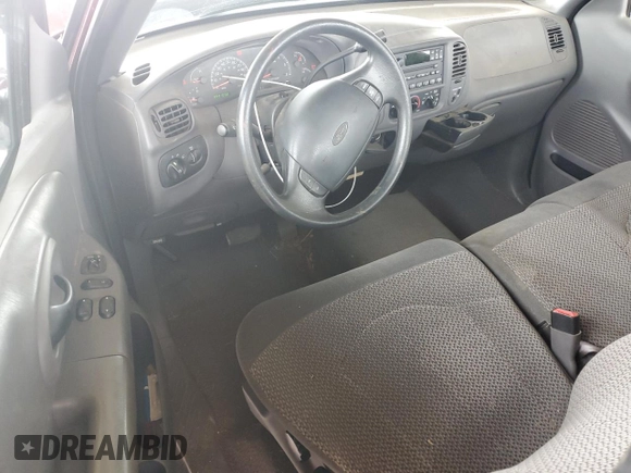 1999 Ford F-150 XL with VIN 2FTRF17L0XCB19827, listed as a Copart auction lot 85282164 with 52,103 mi miles and Salvage title. Bid and sale history available at DreamBid. Image 8.