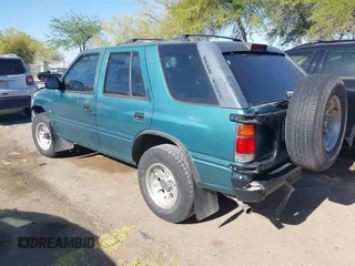 1995 Isuzu Rodeo LS z VIN 4S2CY58V6S4316697, wystawiony jako IAAI lot #42103936 z przebiegiem 143 185 mil mil oraz . Historia ofert i sprzedaży dostępna na DreamBid. Obrazek 3.