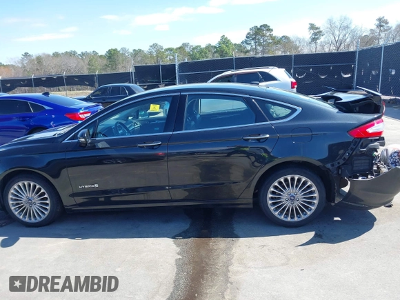 2013 Ford Fusion Titanium Hybrid with VIN 3FA6P0RU2DR288773, listed as a IAAI auction lot 41803708 with 85,868 mi miles and . Bid and sale history available at DreamBid. Image 14.
