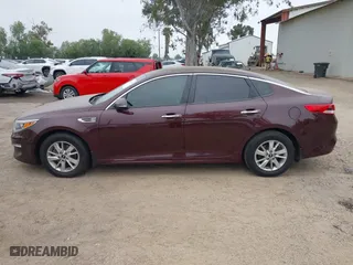 2016 Kia Optima LX with VIN 5XXGT4L30GG075759, listed as a IAAI auction lot 42024856 with 113,740 mi miles. Bid and sale history available at carsss.com. Image 14.