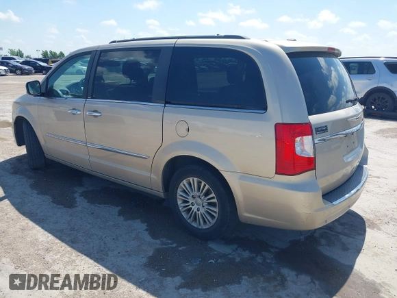 2013 Chrysler Town & Country Touring L with VIN 2C4RC1CG2DR767406, listed as a IAAI auction lot 42067814 with 75,985 mi miles and . Bid and sale history available at DreamBid. Image 3.