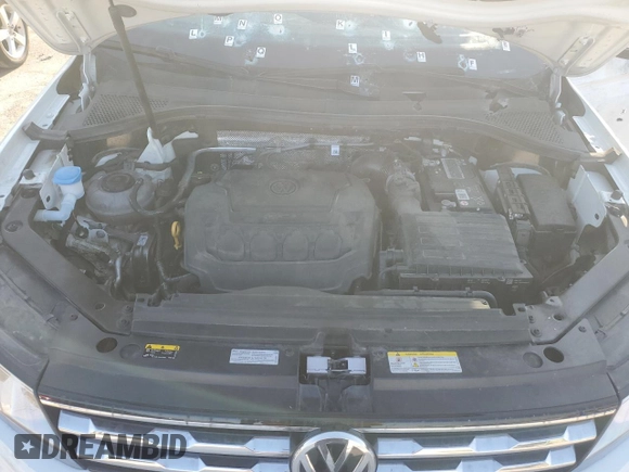 2021 Volkswagen Tiguan S z VIN 3VV1B7AX1MM155177, wystawiony jako Copart lot #70585534 z przebiegiem Nie podano mil oraz Szkoda całkowita • Salvage title. Historia ofert i sprzedaży dostępna na DreamBid. Obrazek 12.