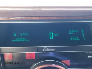 1991 Cadillac Eldorado z VIN 1G6EL13B2MU602660, wystawiony jako Copart lot #67365674 z przebiegiem 108 880 mil mil oraz Szkody całkowita. Historia ofert i sprzedaży dostępna na DreamBid. Obrazek 9.