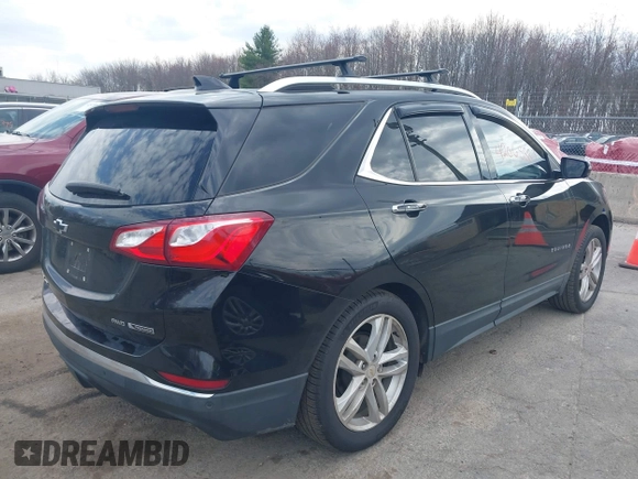 2018 Chevrolet Equinox Premier with VIN 2GNAXWEX6J6302935, listed as a IAAI auction lot 42065883 with 61,983 mi miles and . Bid and sale history available at carsss.com. Image 4.