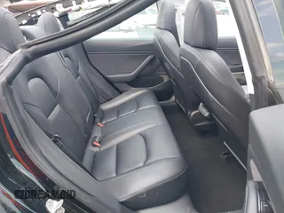 2018 Tesla Model 3 Long Range Battery z VIN 5YJ3E1EB3JF178812, wystawiony jako IAAI lot #42124838 z przebiegiem 124 229 mil mil oraz . Historia ofert i sprzedaży dostępna na DreamBid. Obrazek 8.