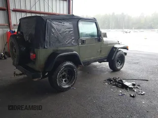 2005 Jeep Wrangler X z VIN 1J4FA39S75P310037, wystawiony jako IAAI lot #42186114 z przebiegiem 154 462 mil mil oraz . Historia ofert i sprzedaży dostępna na DreamBid. Obrazek 4.