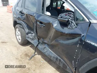 2021 Toyota RAV4 Hybrid LE with VIN 2T3L6RFV7MW011159, listed as a IAAI auction lot 42212998 with 104,626 mi miles and . Bid and sale history available at DreamBid. Image 6.