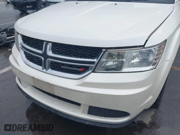 2013 Dodge Journey SE with VIN 3C4PDCAB1DT558033, listed as a IAAI auction lot 41804619 with 204,567 mi miles and . Bid and sale history available at carsss.com. Image 6.