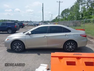 2016 Toyota Camry XLE with VIN 4T1BF1FKXGU259860, listed as a IAAI auction lot 42219507 with 239,145 mi miles and . Bid and sale history available at DreamBid. Image 14.