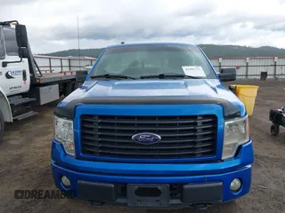2014 Ford F-150 XL with VIN 1FTMF1EM4EFC77675, listed as a IAAI auction lot 41905732 with 76,648 mi miles. Bid and sale history available at carsss.com. Image 12.