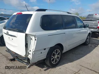 2014 Kia Sedona LX with VIN KNDMG4C75E6545483, listed as a IAAI auction lot 42166152 with 121,827 mi miles and . Bid and sale history available at carsss.com. Image 4.