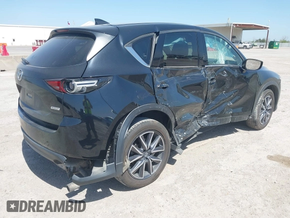 2018 Mazda CX-5 Grand Touring with VIN JM3KFADM8J0330035, listed as a IAAI auction lot 41878680 with 62,632 mi miles. Bid and sale history available at carsss.com. Image 4.