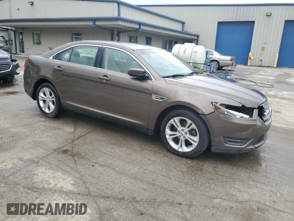 2015 Ford Taurus SEL z VIN 1FAHP2E84FG102075, wystawiony jako Copart lot #59740265 z przebiegiem 90 669 mil mil oraz Szkoda całkowita • Salvage title. Historia ofert i sprzedaży dostępna na DreamBid. Obrazek 4.
