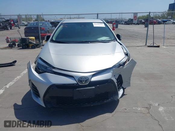 2019 Toyota Corolla L with VIN 5YFBURHE5KP877691, listed as a IAAI auction lot 42108591 with 85,813 mi miles and . Bid and sale history available at DreamBid. Image 12.