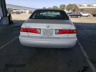 2001 Toyota Camry CE z VIN JT2BG22K010543907, wystawiony jako Copart lot #60874815 z przebiegiem 313 008 mil mil oraz Czysty tytuł • Clean title. Historia ofert i sprzedaży dostępna na DreamBid. Obrazek 6.