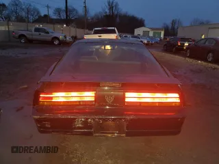 1990 Pontiac Firebird with VIN 1G2FS23TXLL205077, listed as a Copart auction lot 44035705 with 142,809 mi miles and Salvage title. Bid and sale history available at DreamBid. Image 6.