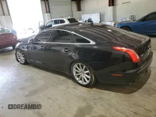2014 Jaguar XJ with VIN SAJWA1CZ0E8V61168, listed as a Copart auction lot 54383215 with 137,724 mi miles and Salvage Title. Bid and sale history available at DreamBid. Image 2.
