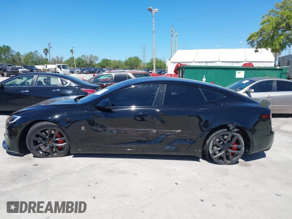 2023 Tesla Model S Plaid with VIN 5YJSA1E67PF528171, listed as a IAAI auction lot 41831086 with Not provided miles and . Bid and sale history available at DreamBid. Image 13.