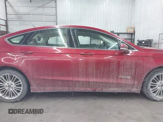 2014 Ford Fusion SE Hybrid with VIN 3FA6P0LU5ER136237, listed as a IAAI auction lot 41590088 with 174,009 mi miles. Bid and sale history available at carsss.com. Image 13.