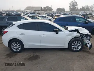 2014 Mazda Mazda3 i Touring with VIN JM1BM1L7XE1113628, listed as a IAAI auction lot 41218193 with 166,469 mi miles. Bid and sale history available at carsss.com. Image 14.