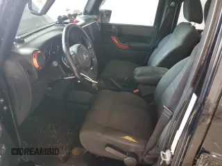 2012 Jeep Wrangler Unlimited Sahara with VIN 1C4BJWEG3CL195271, listed as a Copart auction lot 59947235 with 212,819 mi miles and Salvage title. Bid and sale history available at DreamBid. Image 7.