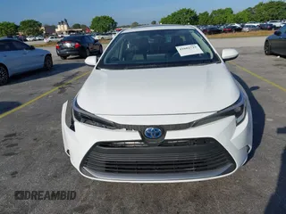 2024 Toyota Corolla Hybrid LE with VIN JTDBCMFE2RJ031865, listed as a IAAI auction lot 41602715 with 10,892 mi miles. Bid and sale history available at carsss.com. Image 12.