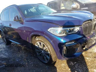 2020 BMW X5 M50i with VIN 5UXJU4C03LL227857, listed as a IAAI auction lot 41351112 with 65,325 mi miles. Bid and sale history available at carsss.com. Image 1.