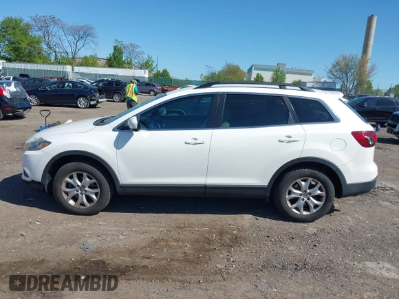 2015 Mazda CX-9 Touring with VIN JM3TB3CV1F0461403, listed as a IAAI auction lot 42148325 with 143,452 mi miles. Bid and sale history available at carsss.com. Image 14.