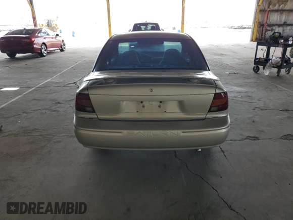 2002 Saturn SL z VIN 1G8ZH52842Z165459, wystawiony jako Copart lot #57273035 z przebiegiem 84 482 mil mil oraz Szkoda całkowita • Salvage title. Historia ofert i sprzedaży dostępna na DreamBid. Obrazek 6.