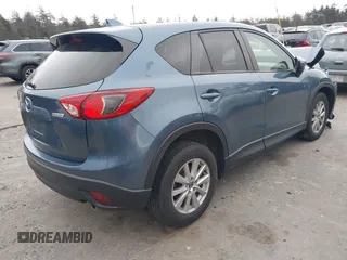 2015 Mazda CX-5 Touring with VIN JM3KE4CY1F0545305, listed as a IAAI auction lot 41234599 with 92,791 mi miles. Bid and sale history available at carsss.com. Image 4.