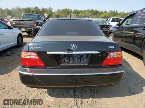2002 Acura RL with VIN JH4KA96512C013028, listed as a Copart auction lot 71436914 with 142,527 mi miles and Salvage Title. Bid and sale history available at carsss.com. Image 6.