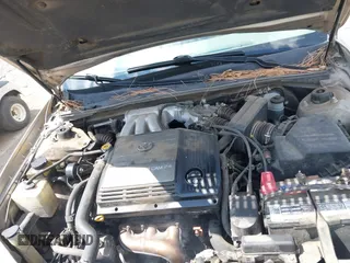 2001 Toyota Avalon XL w/Bucket Seats with VIN 4T1BF28B61U185881, listed as a IAAI auction lot 42138345 with 242,195 mi miles. Bid and sale history available at carsss.com. Image 10.