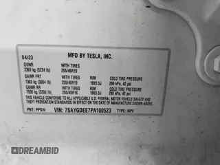 2023 Tesla Model Y Long Range with VIN 7SAYGDEE7PA100523, listed as a IAAI auction lot 40399455 with 18,885 mi miles and . Bid and sale history available at DreamBid. Image 9.